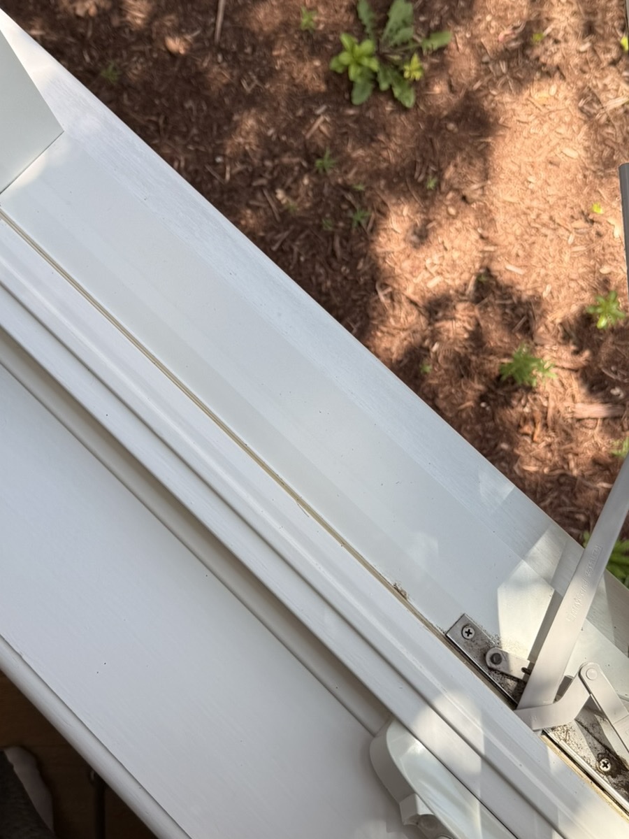 Casement window sill and track after Clear View detailing — clean white channel