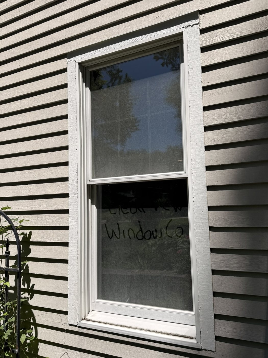 Window before cleaning — dusty, hazy glass