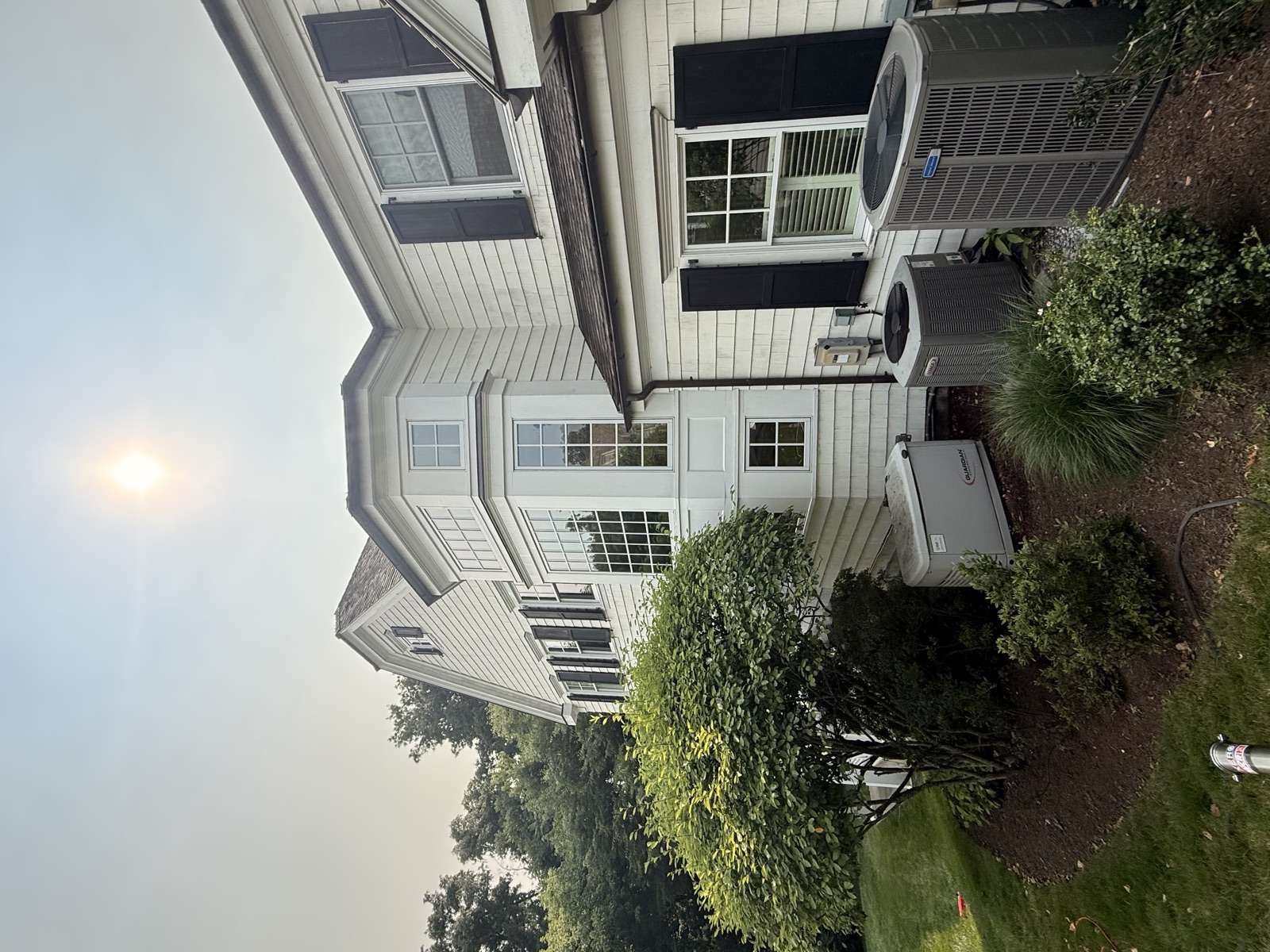White colonial Connecticut home with clean bay windows by Clear View