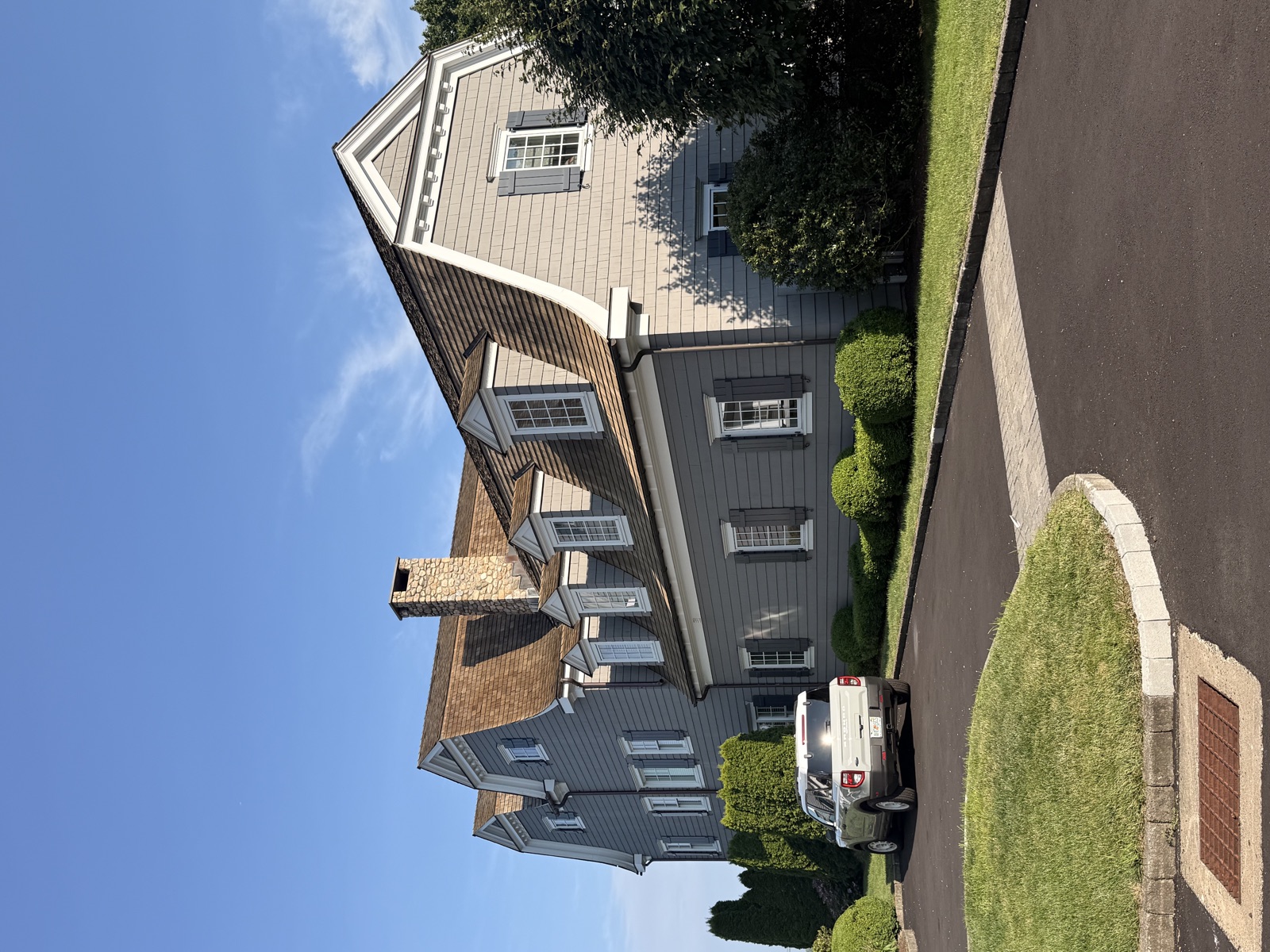 Gray shingle Connecticut colonial with freshly cleaned windows, Clear View