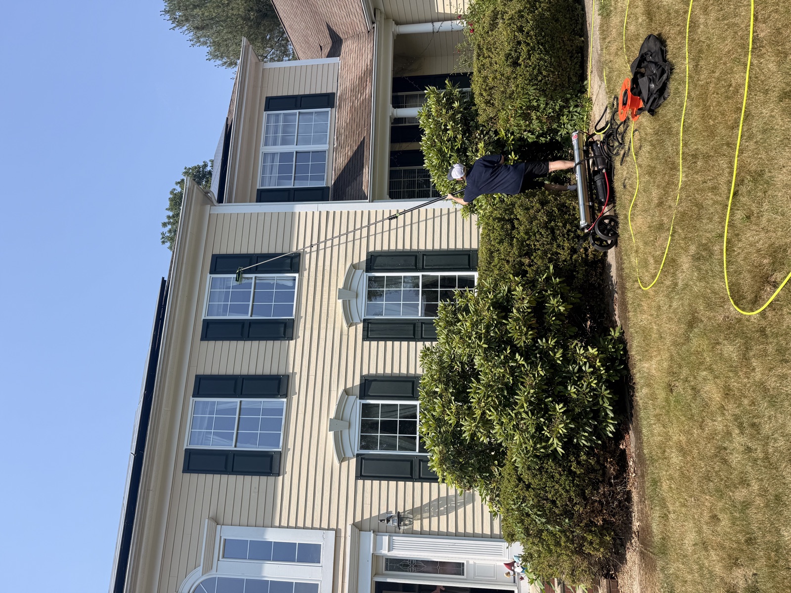 Water-fed pole cleaning of a Connecticut colonial's upper windows by Clear View
