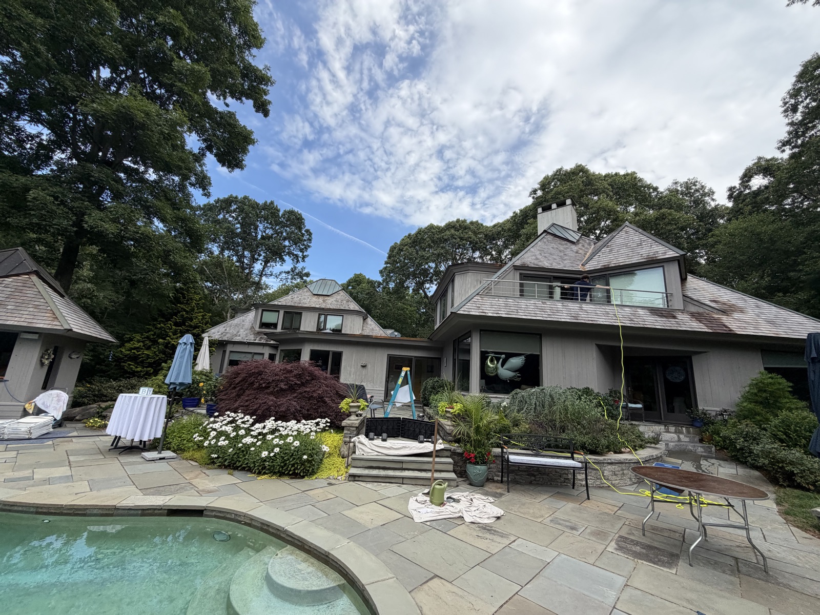 Contemporary Connecticut home with poolside patio and clean windows, Clear View