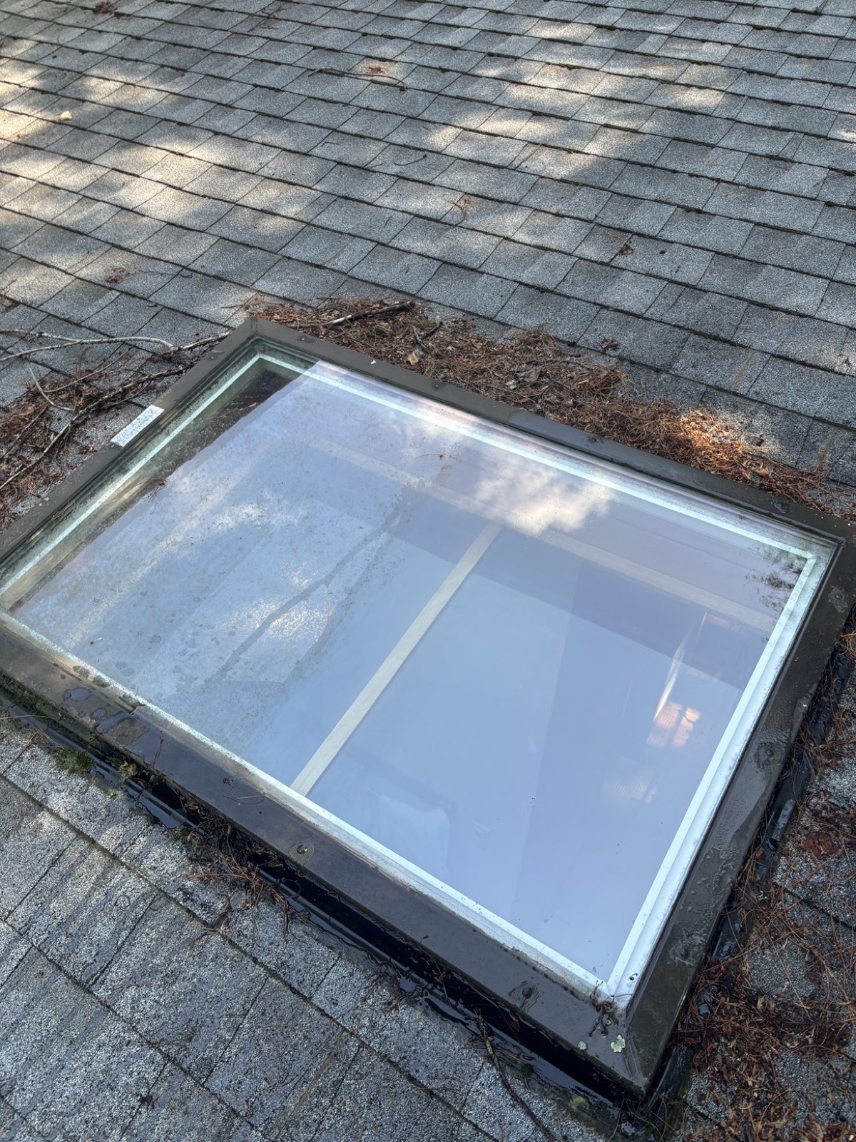 Roof skylight mid-clean by Clear View — hard-water haze lifting to clear glass, Connecticut