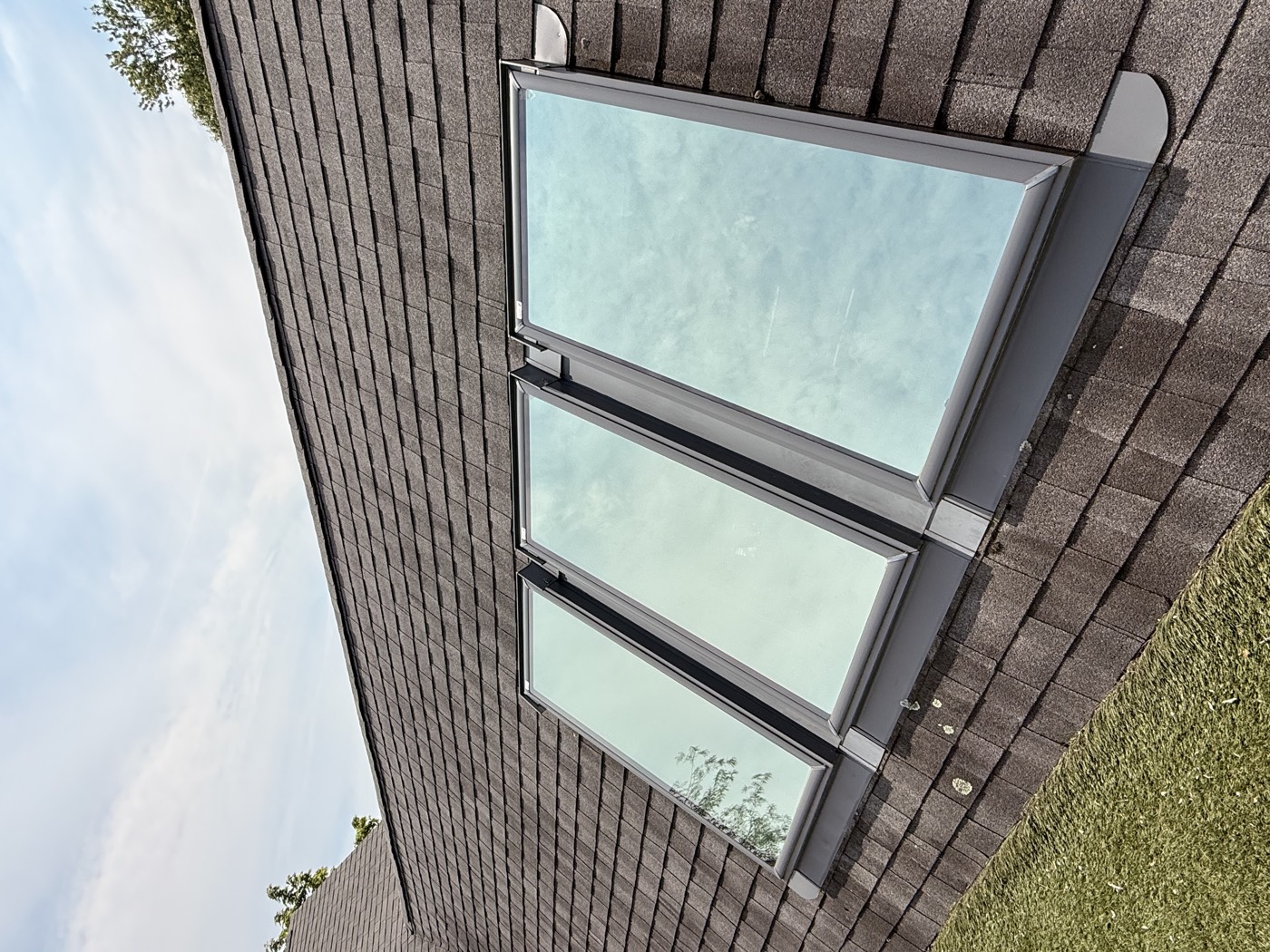 Bank of three roof skylights cleaned to clear glass by Clear View Window Co. on a Connecticut shoreline home