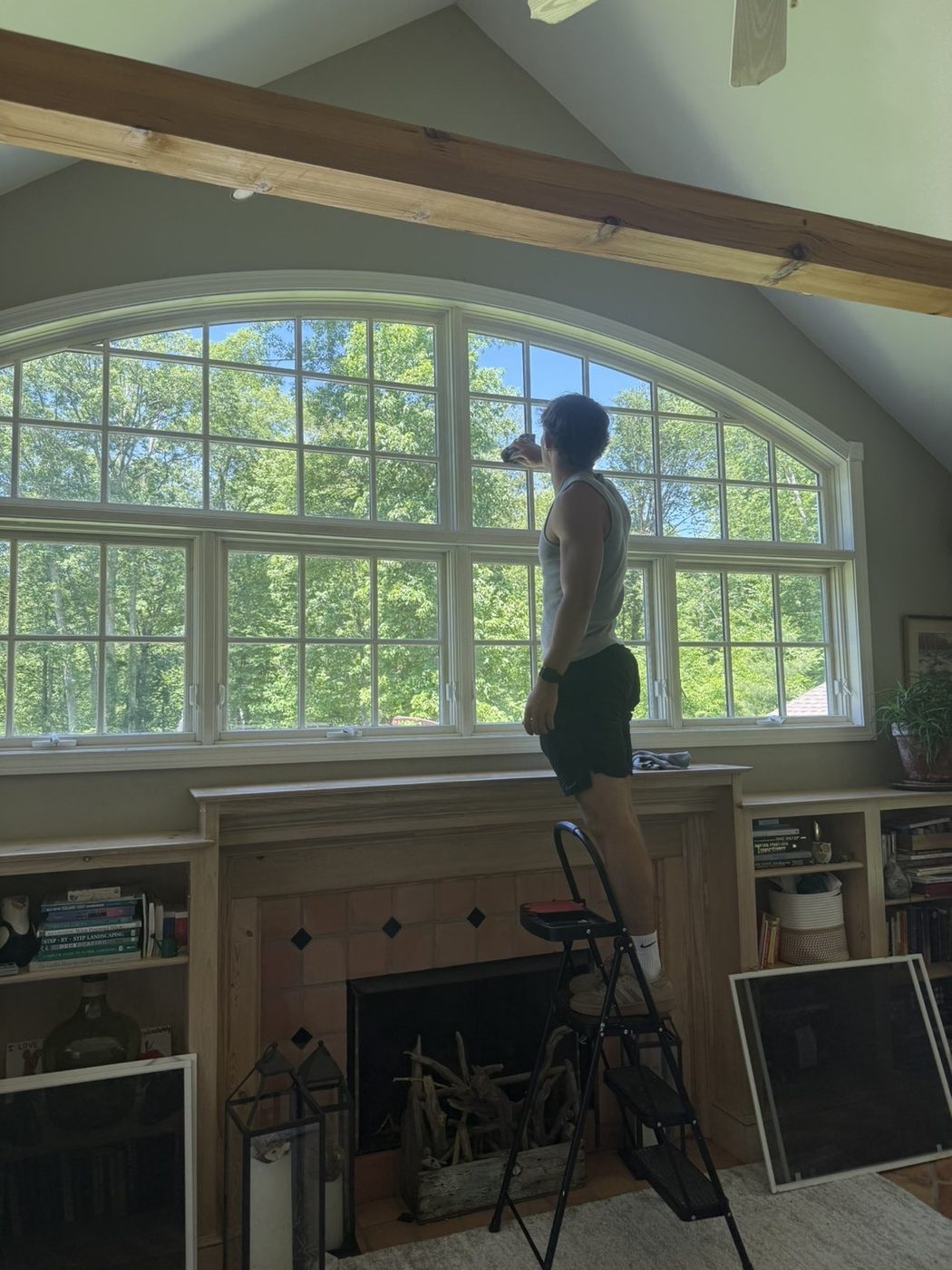 Interior cleaning of large arched feature window by Clear View Window Co. in Connecticut